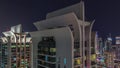 Aerial view of JLT and Dubai marina skyscrapers with glowing windows night with traffic on sheikh zayed road. Royalty Free Stock Photo