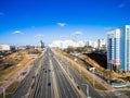 Aerial view at junctions of city highway. Vehicles drive on roads. Russia