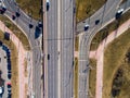 Aerial view at junctions of city highway. Vehicles drive on roads. Russia