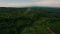Aerial view jungle village canyon active volcano eruption smoke stream disaster