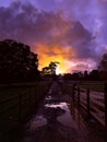 Aerial view 4k small town in Rutland, UK. Rutland water lake sunset, moon out and stormy clouds Royalty Free Stock Photo