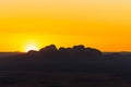 Aerial view of Kata Tjuta mountain in Australia covered in desert land at sunset