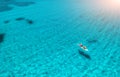 Aerial view of kayak with people in blue sea at sunset in summer Royalty Free Stock Photo