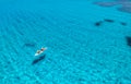 Aerial view of kayak with people in blue sea at sunset in summer Royalty Free Stock Photo