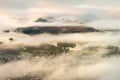 Aerial view of Keswick and Derwentwater with snowcapped mountains on a Winter morning. Lake District, UK.