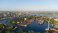 Aerial view of the Kherson city. The Dnieper River of which there are cranes and ships. Residential area with houses