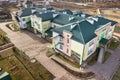 Aerial view of kindergarten or modern school complex, decorated building roofs and colorful playground on sunny yard Royalty Free Stock Photo