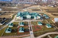 Aerial view of kindergarten or modern school complex, decorated building roofs and colorful playground on sunny yard Royalty Free Stock Photo