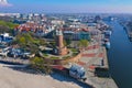 Aerial view on Kolobrzeg city, area of Lighthouse at baltic sea shore and ship port Royalty Free Stock Photo