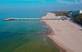 Aerial view on Kolobrzeg city, area of pier and beach at baltic sea shore