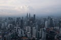 Aerial view of Kuala Lumpur city skyline during cloudy day