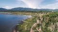 Aerial view of Lake along the forest by drone. Landscape and nature theme Royalty Free Stock Photo