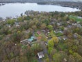 Aerial view of lake Attitash and a town near a shoreline surrounded by colorful trees in autumn Royalty Free Stock Photo