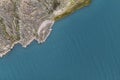 Aerial view of a lake bay next to rocky cliffs Royalty Free Stock Photo