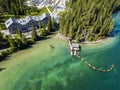 Aerial view of the Lake Braies, Pragser Wildsee is a lake in the Prags Dolomites in South Tyrol, Italy. View of rowboats moored