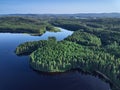 Aerial view of lake, islands, and forest.