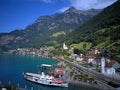 Aerial view of Lake Lucerne with a sightseeing boat cruising on the lake, railway tracks stretching along the shore Royalty Free Stock Photo