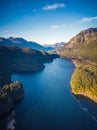 Aerial view of Lake surrounded by Trees and Mountains near Vancouver, BC, Canada Royalty Free Stock Photo