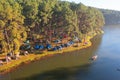 Aerial view of lakeside reservoir camping tents area, nature environment landscape. Pang Ung, Mae Hon Son, Northern, Thailand.