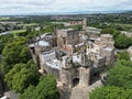 Aerial view of the Lancaster Castleand the city skyline amidst a lush green landscape of trees