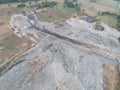 An aerial view of a landfill full of waste. Ecological treatment of junk waste. Open trash in solid form.