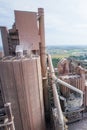 Aerial view, landscape of cement factory, village and paddy fields. Bright sunlight