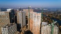 Aerial view of landscape in the city with under construction buildings and industrial cranes. Construction site. Royalty Free Stock Photo