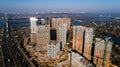 Aerial view of landscape in the city with under construction buildings and industrial cranes. Construction site. Royalty Free Stock Photo