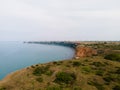 Aerial view landscape of headland sea and wind turbines background Royalty Free Stock Photo