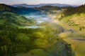 Aerial view landscape over remote village from Transylvania, Shepherd house in summer time in Romania