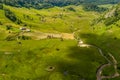 Aerial view landscape over remote village from Transylvania, Shepherd house in summer time in Romania