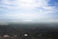 Aerial view landscape and rice field or paddy land from Khao Phraya Doen Thong viewpoint with valley village hill and clouds sky