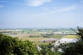 Aerial view landscape and rice field or paddy land from viewpoint of Wat Khao Sanam Chaeng temple with valley village hill for