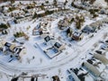 Aerial view of landscape top of the winter town residential houses with snow covered houses and roads Royalty Free Stock Photo