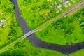Aerial view landscape of winding small river among the small town, stream in green field, top view meadow Royalty Free Stock Photo