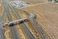 Aerial view of large car trucks park for highway rest area highway infrastructure near interstate desert route in United