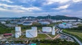 Aerial view of large fuel storage tanks at oil refinery industrial zone, White oil storage tanks farm. Royalty Free Stock Photo