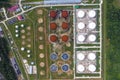 Aerial view of large fuel storage tanks at oil refinery industrial zone, White oil storage tanks farm Royalty Free Stock Photo