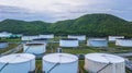 Aerial view of large fuel storage tanks at oil refinery industrial zone, White oil storage tanks farm. Royalty Free Stock Photo