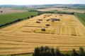 aerial view of a large hay bale maze in a sunny field