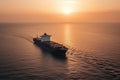 Aerial view of a large, heavy loaded container cargo ship at sunset