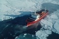 Aerial view of Large icebreaker vessel loaded with containers sailing in ice-cold ocean.