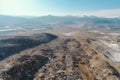 aerial view of large landfill with mountains of trash visible from above