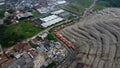 Aerial View. Large landfills like mountains. the tractor take garbage on landfills at Bekasi - Indonesia Royalty Free Stock Photo