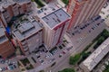 Aerial view of a large number of cars of different brands and colors standing in a parking lot near the house in a chaotic manner Royalty Free Stock Photo