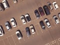 Aerial view of a large number of cars of different brands and colors standing in a parking lot near the shopping center Royalty Free Stock Photo