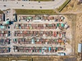Aerial view of a large number of iron garages for cars with colored roofs standing in close to each other near the road fenced. Royalty Free Stock Photo
