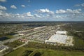 Aerial view of large parking lot in front of rgocery store with many parked colorful cars. Carpark at supercenter Royalty Free Stock Photo