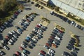 Aerial view of large parking lot in front of rgocery store with many parked colorful cars. Carpark at supercenter Royalty Free Stock Photo