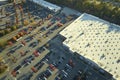 Aerial view of large parking lot in front of rgocery store with many parked colorful cars. Carpark at supercenter Royalty Free Stock Photo